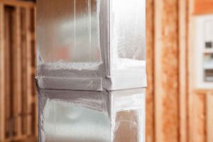 A house air duct, during construction, showing a joint which has been caulked with sealant. Caulking ducts prevents air-conditioned or heated air from escaping the duct and prevents ambient air from entering the system