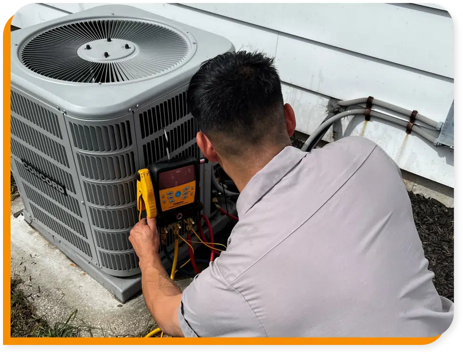 Tech working on Air Conditioning unit in Brookfield