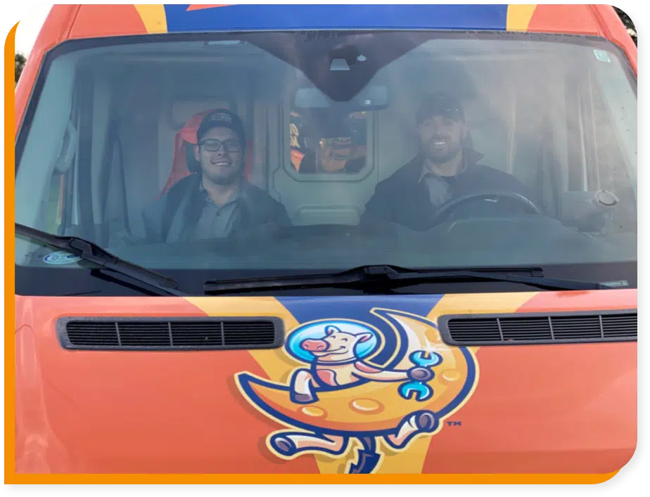 Over the Moon Heating, Air & Electrical techs in van in Brookfield