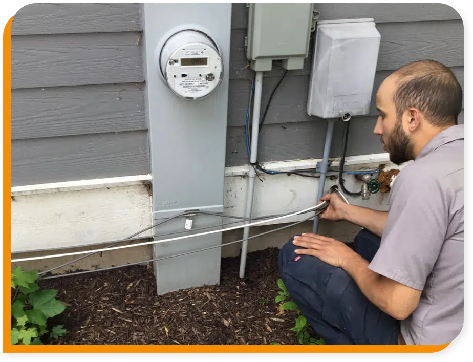 Technician wiring outside in Brookfield